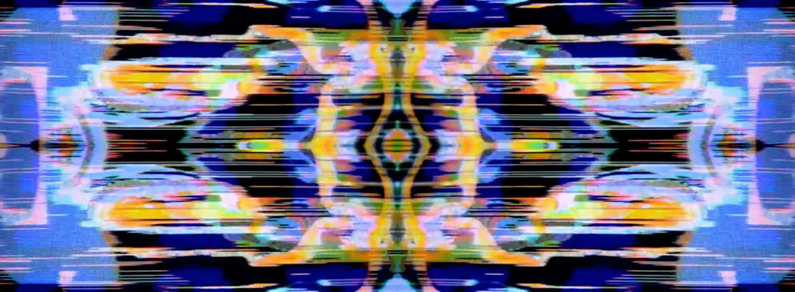 A frame of live VJ output: mirrored analogue video torn into bands of colour by tape and scan artefacts.